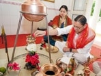 Uttarakhand Chief Minister Pushkar Singh Dhami and his wife, Geeta Dhami, perform a ritual while offering prayers in Dehradun on Sunday.