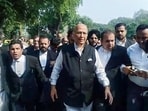 Senior Advocate and Congress MP Abhishek Manu Singhvi, along with lawyers, heads to the Supreme Court in New Delhi on Monday. 