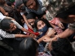 Delhi protests LIVE: Protesters react as they are detained by security personnel during a protest seeking the resignation of Chief Election Commissioner Gyanesh Kumar, in New Delhi.