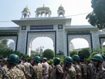 Security personnel stand guard outside the entrance gate of Gurdwara Bangla Sahib during an agitation called by Cockroach Janta Party (CJP) against Chief Election Commissioner (CEC) Gyanesh Kumar over alleged electoral roll irregularities, in New Delhi.