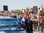 In this image posted on Oct. 11, 2026, Prime Minister Narendra Modi waves to supporters standing along the route during a roadshow upon his arrival in Chennai. PM Modi visited the city to inaugurate multiple development projects worth over 13,000 crore and launch Phase II of Chennai Metro Rail.
