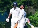 Bengal's Sudip Gharami celebrates his half century as Abishek Porel, left, looks on during the 2nd day of the Ranji Trophy cricket match between Bengal and Delhi Bengal's Sudip Gharami celebrates his half century as Abishek Porel, left, looks on during the 2nd day of the Ranji Trophy cricket match between Bengal and Delhi