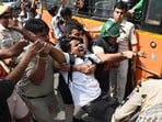 Police detaining a protester during the protest in New Delhi. (AP)