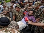 Police personnel detain CPI (M) MP John Brittas in Connaught Place area on Sunday. (PTI)
