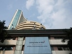 A screen displays a message of the National Stock Exchange (NSE) listing ceremony at the Bombay Stock Exchange (BSE) in Mumbai on September 24