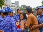 Security personnel detain demonstrators during a protest near Jantar Mantar on Sunday. (Vipin Kumar/HT)