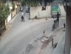 Video grab of the man shooting the dog dead (SOURCED)