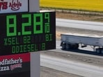 A semi drives past a sign advertising the price of diesel along Interstate 5 in Williams, Calif., Sept. 28.