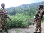 Security personnel stand guard along the Rajouri-Poonch National Highway in file photo.