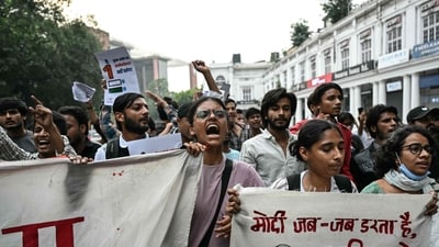 Demonstrators shout slogans during a protest demanding the resignation of Chief Election Commissioner Gyanesh Kumar over alleged voter roll irregularities in Delhi on Sunday. (AFP)