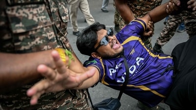 Security personnel detain a demonstrator during a protest demanding the resignation of India's Chief Election Commissioner Gyanesh Kumar over alleged voter roll irregularities linked to the "special intensive revision" (SIR), near Jantar Mantar in New Delhi on October 11. (AFP) Security personnel detain a demonstrator during a protest demanding the resignation of India's Chief Election Commissioner Gyanesh Kumar over alleged voter roll irregularities linked to the "special intensive revision" (SIR), near Jantar Mantar in New Delhi on October 11. (AFP)