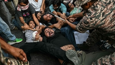 Security personnel detain demonstrators during a protest demanding the resignation of India's Chief Election Commissioner Gyanesh Kumar over alleged voter roll irregularities linked to the "special intensive revision" (SIR), near Jantar Mantar in New Delhi (AFP)