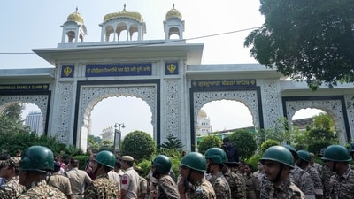 Security personnel stand guard outside the entrance gate of Gurdwara Bangla Sahib during an agitation called by Cockroach Janta Party (CJP) against Chief Election Commissioner (CEC) Gyanesh Kumar over alleged electoral roll irregularities, in New Delhi. (PTI) Security personnel stand guard outside the entrance gate of Gurdwara Bangla Sahib during an agitation called by Cockroach Janta Party (CJP) against Chief Election Commissioner (CEC) Gyanesh Kumar over alleged electoral roll irregularities, in New Delhi. (PTI)