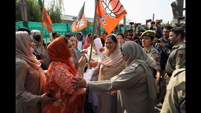 Security personnel stop BJP workers during a protest against the Congress near its office in Srinagar on Monday. (ANI) Security personnel stop BJP workers during a protest against the Congress near its office in Srinagar on Monday. (ANI)