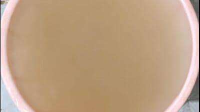 The visibly dirty water seen on Monday at one home in I-Block of Sector Beta 2, Greater Noida. (HT Photo)