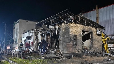 Rescuers work in a shop destroyed following a Russian missile attack in Pesochin settlement, a suburb of Kharkiv, which killed three people and wounded 22, on October 11, 2026, amid the Russian invasion of Ukraine. (Photo by SERGEY BOBOK / AFP) (AFP) Rescuers work in a shop destroyed following a Russian missile attack in Pesochin settlement, a suburb of Kharkiv, which killed three people and wounded 22, on October 11, 2026, amid the Russian invasion of Ukraine. (Photo by SERGEY BOBOK / AFP) (AFP)