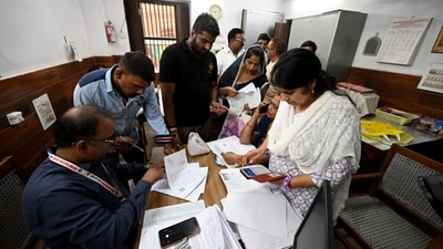 Voters arrive at a voter center to seek clarification and make correction to their SIR Forms at Laxmi Devi School Sadar Bazar, in New Delhi. (Ishant Chauhan/HT)