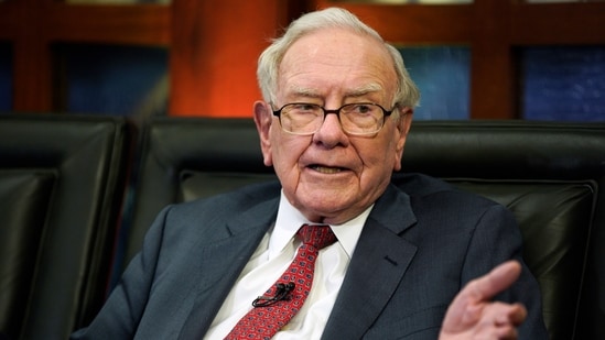 Warren Buffett's S&P 500 ETF strategy amid rising AI stock valuations and stock market bubble fears. (AP Photo/Nati Harnik, File)