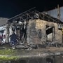 Rescuers work in a shop destroyed following a Russian missile attack in Pesochin settlement, a suburb of Kharkiv, which killed three people and wounded 22, on October 11, 2026, amid the Russian invasion of Ukraine. (Photo by SERGEY BOBOK / AFP)