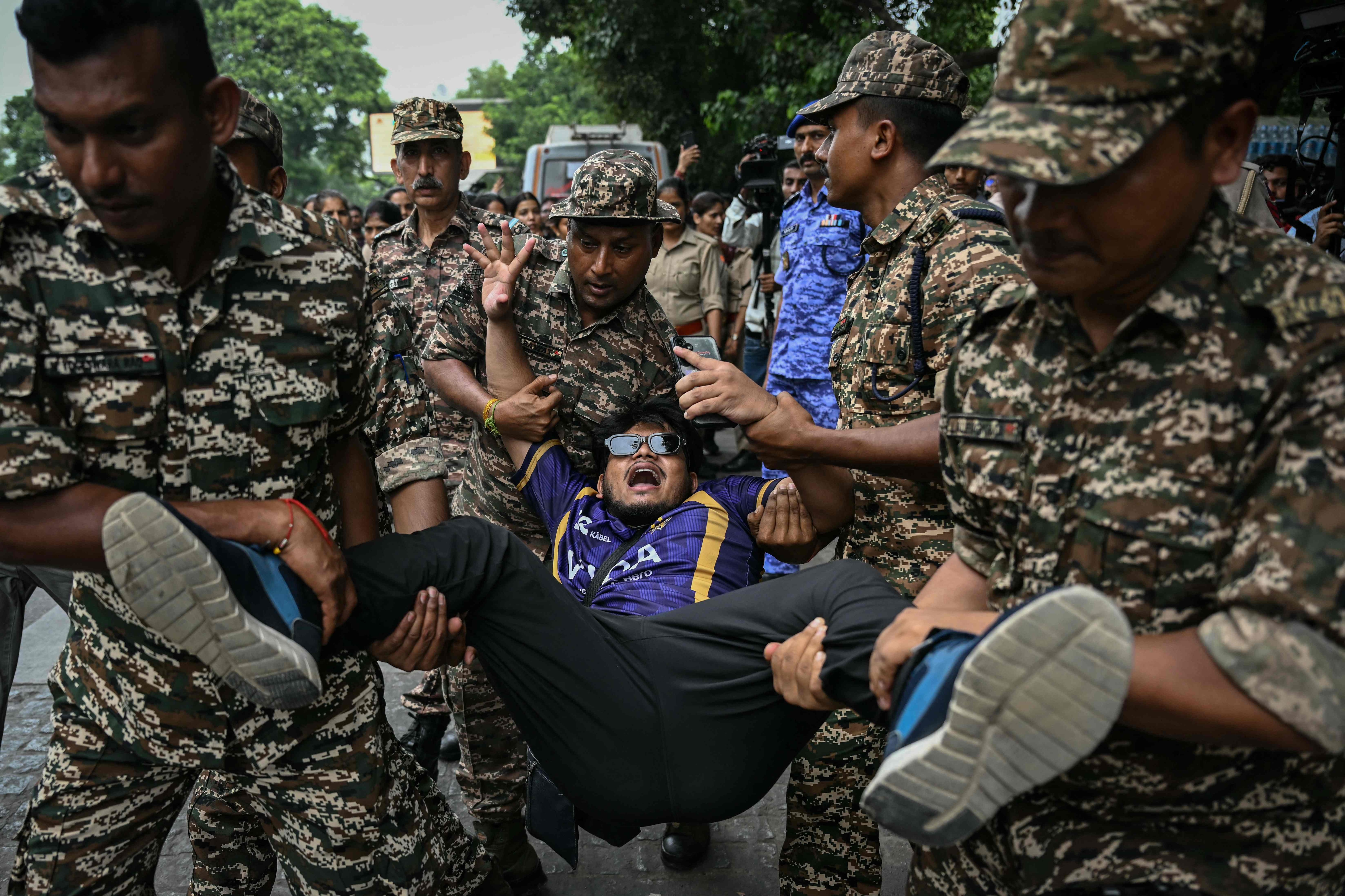 Security personnel detain a demonstrator during a protest demanding the resignation of India's Chief Election Commissioner Gyanesh Kumar over alleged voter roll irregularities linked to the 'special intensive revision' (SIR), near Jantar Mantar in New Delhi on October 11, 2026. (AFP) Security personnel detain a demonstrator during a protest demanding the resignation of India's Chief Election Commissioner Gyanesh Kumar over alleged voter roll irregularities linked to the 'special intensive revision' (SIR), near Jantar Mantar in New Delhi on October 11, 2026. (AFP)