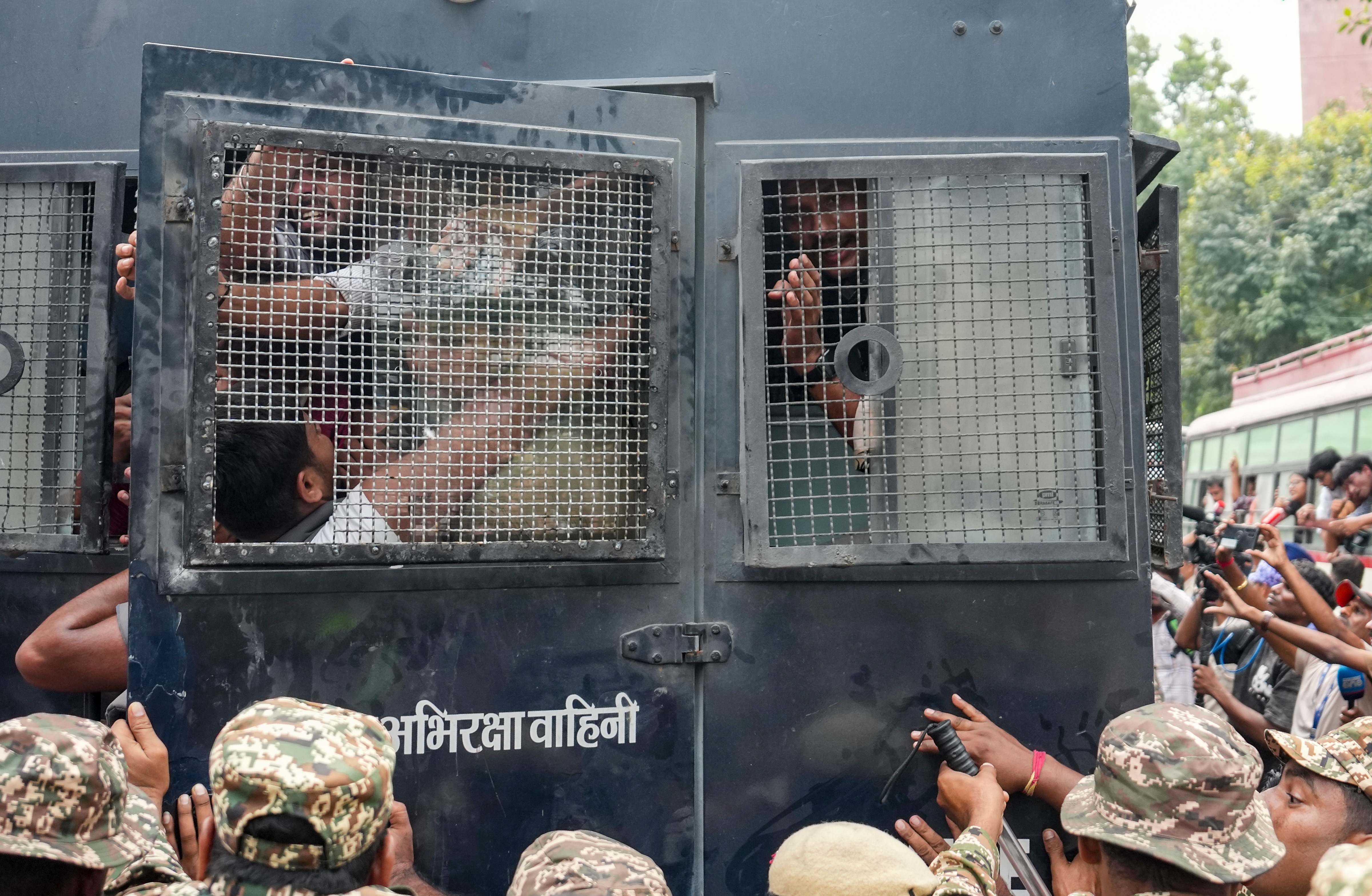 Police personnel detain protestors amid continued demonstration in Connaught Place area on Sunday. (PTI) Police personnel detain protestors amid continued demonstration in Connaught Place area on Sunday. (PTI)