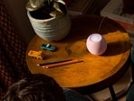 The new Apple HomePod mini 2 retains its compact design while adding upgraded audio processing, smart home features and Siri AI support through a future software update.