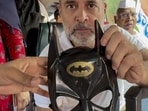 Congress chief Kharge also wore a batman mask to support the students. (@nsui/PTI)