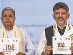 Karnataka chief minister DK Shivakumar and his predecessor, Siddaramaiah. (PTI)