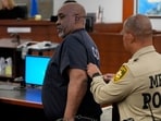 Duane Davis is escorted by police from a sentencing hearing after his murder conviction in the death of rapper Tupac Shakur on Tuesday, Oct. 13, 2026, in Las Vegas, Nevada, US.     John Locher/Pool via REUTERS     TPX IMAGES OF THE DAY