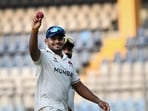 Tushar Deshpande celebrates after taking five wickets. 