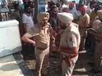 Police outside the chemist shop in Mansa, where anti-drug activist Parminder Singh Jhota was shot at on Tuesday morning. He later succumbed to injuries in hospital. (HT Photo)