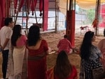 Residents from Sectors 107, 108 and 109, including families from more than 10 residential societies, attended the traditional Khunti Puja and Kalash Sthapana ceremonies on October 10. (HT Photo)