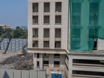The project, being executed by Vrihis Properties Pvt Ltd, a constituent of realty firm BGRE (formerly Brookfield Properties), involves redevelopment of an existing two-storey structure on a nearly four-acre plot into a tower comprising three basements, ground floor and 18 upper floors. (Satish Bate / Hindustan Times)