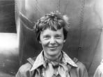 Amelia Earhart standing under nose of her Lockheed Model 10-E Electra. Gelatin silver print, 1937.(National Portrait Gallery, Smithsonian Institution/ via Wikimedia Commons)