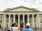 US Treasury yields fall as oil prices drop ahead of key US inflation data.