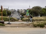 A cyclist moving through the park in 2025.
