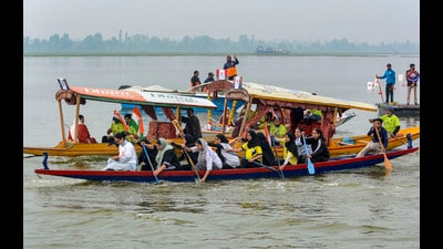 Atheltes take part in a race during 'Jashn-e-Dal' organised to promote tourism in the Valley at Dal Lake in Srinagar on Tuesday. (PTI)