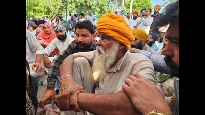 Parminder Singh's father sitting in protest in Mansa on Tuesday. (Sanjeev Kumar/HT)