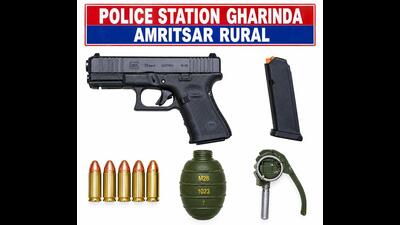 The Amritsar rural police arrested six people in two interlinked cases and recovered a hand grenade and a 9MM pistol along with five live cartridges from the accused. (HT) The Amritsar rural police arrested six people in two interlinked cases and recovered a hand grenade and a 9MM pistol along with five live cartridges from the accused. (HT)