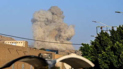 A plume of smoke rises during a reported airstrike by the Saudi-led coalition on the Houthi-controlled Yemeni capital Sanaa, on October 9, 2026. (AFP) A plume of smoke rises during a reported airstrike by the Saudi-led coalition on the Houthi-controlled Yemeni capital Sanaa, on October 9, 2026. (AFP)