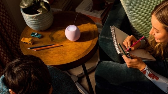 The new Apple HomePod mini 2 retains its compact design while adding upgraded audio processing, smart home features and Siri AI support through a future software update.