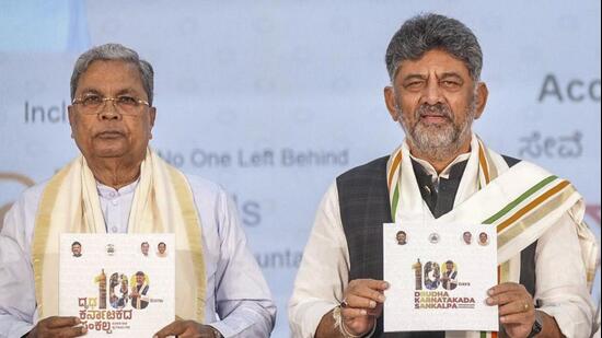 Karnataka chief minister DK Shivakumar and his predecessor, Siddaramaiah. (PTI)