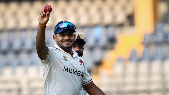 Tushar Deshpande celebrates after taking five wickets.