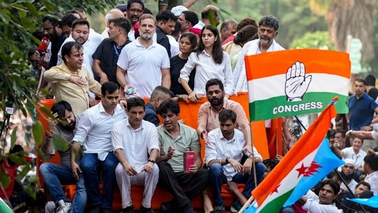 Karnataka Chief Minister DK Shivakumar, Congress leaders Rahul Gandhi, Imran Pratapgarhi and Deepender Singh Hooda, RJD leader Tejashwi Yadav, and others INDIA bloc leaders proceed in a bus towards the Supreme Court to file a petition against Special Intensive Revision (SIR) of electoral rolls and alleged poll irregularities during 'March for Democracy', in New Delhi, Monday, Oct. 12, 2026. NSUI President Vinod Jakhar is also seen.