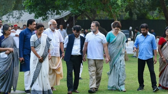 Lok Sabha LoP Rahul Gandhi with party leader Priyanka Gandhi Vadra, Telangana CM Revanth Reddy, JMM leader Mahua Majhi, NCP (SP) leader Supriya Sule and others during a high tea organised for the INDIA bloc leaders at his residence, to discuss the strategy for joint protests against Chief Election Commissioner Gyanesh Kumar's resignation. (AICC)