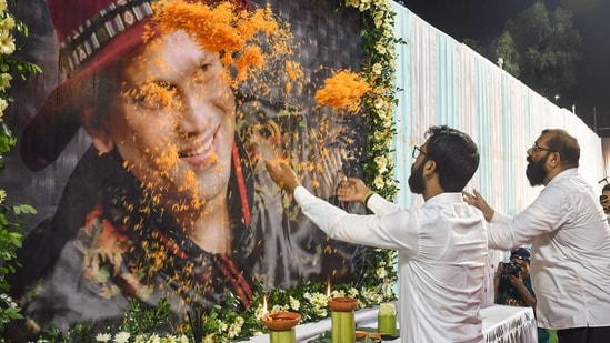 All Assam Students’ Union chief Advisor Samujjal Kumar Bhattacharya and AASU President Utpal Sarma pay floral tribute to a portrait of late singer Zubeen Garg on his first death anniversary at Latashil Playground, in Guwahati on Saturday.