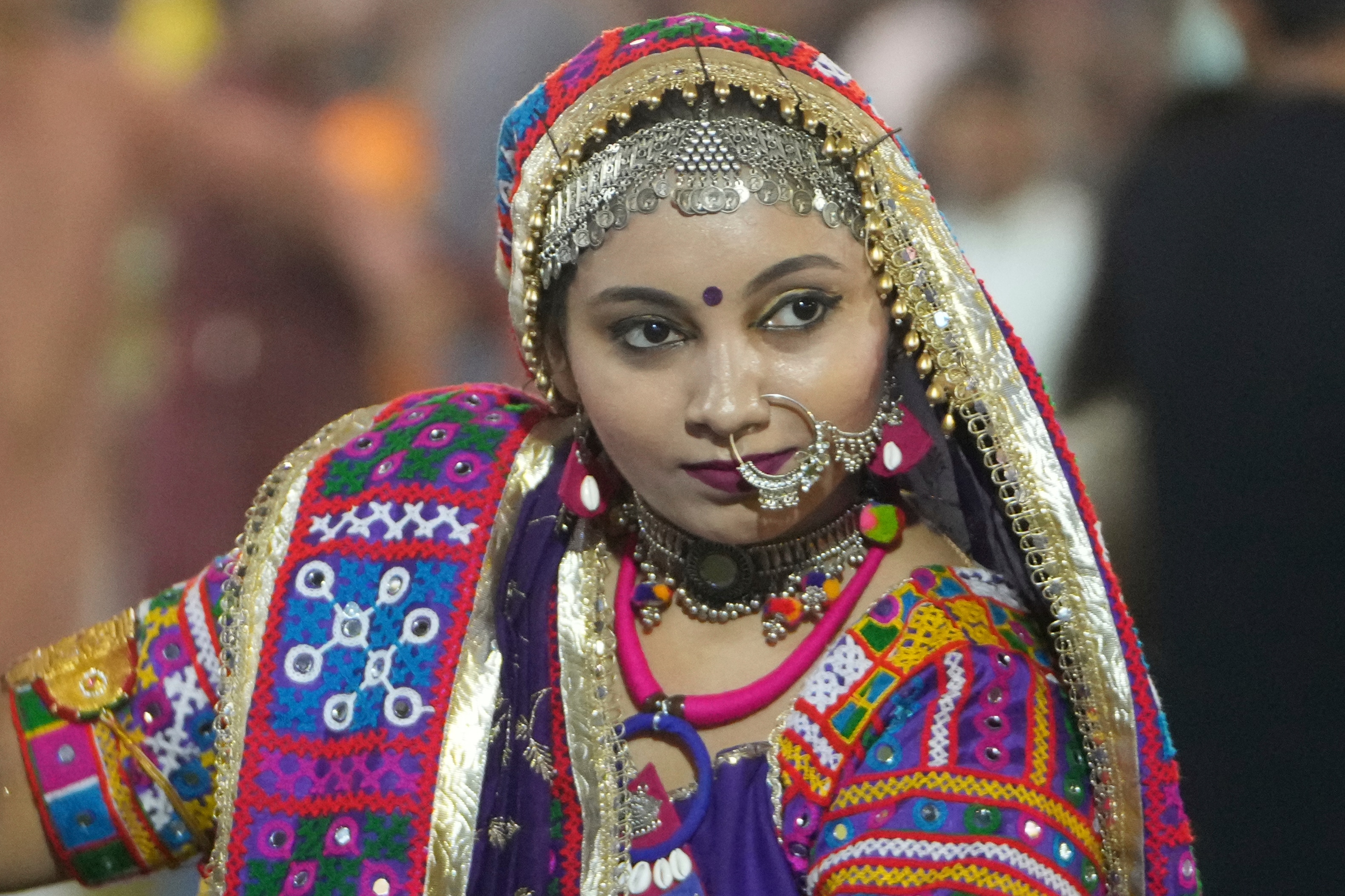 A woman in traditional attire performs Gujarat state's folk dance called Garba during the celebration of nine nights Hindu festival Navratri, in Ahmedabad. (AP Photo)