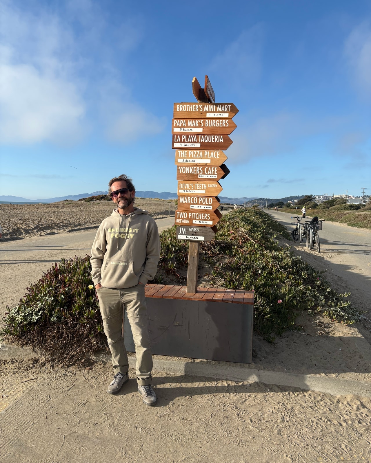 Jeff Daniel, a leader in the Friends of Sunset Dunes group, helped make wooden signs directing visitors to nearby restaurants and shops.