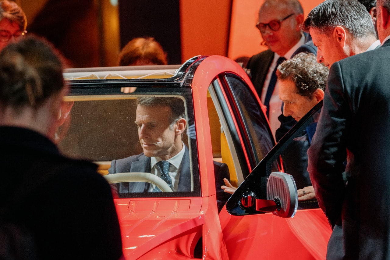 Emmanuel Macron trying the new Citroën 2CV at the Paris Motor Show. Emmanuel Macron trying the new Citroën 2CV at the Paris Motor Show.