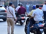 A 10-second video clip, reportedly captured by a car’s dashboard camera, showed at least three motorcyclists skidding on the freshly painted carriageway of the flyover while it was drizzling. (HT Photo/ Representative)